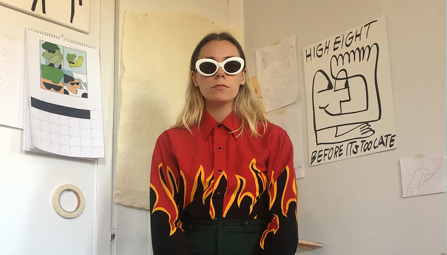 Woman with white retro sunglasses and black shirt with flames